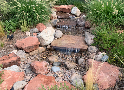 beautiful cascading water feature with flagstones