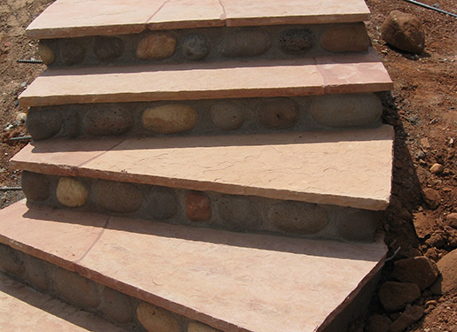 flagstone stairs with stone insets in step-down