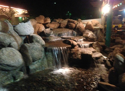 nighttime shot of a cascading water feature